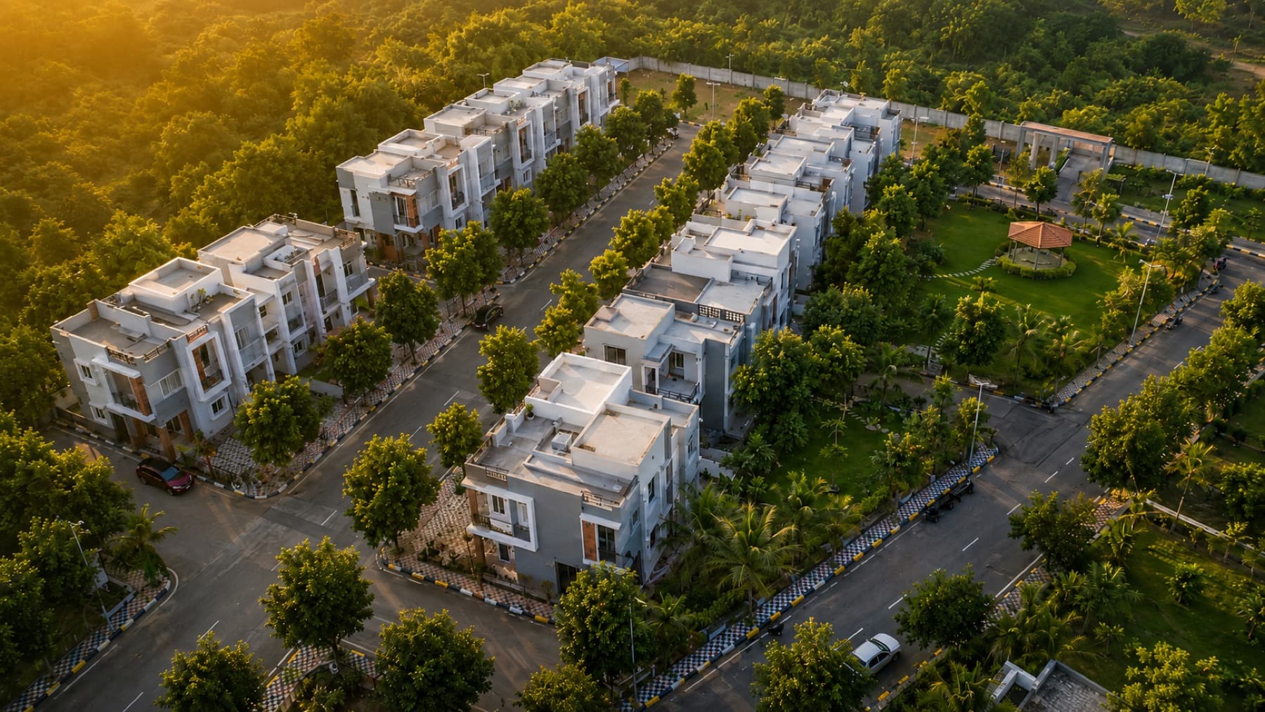 Aerial view of a Medhyam Dwellings villa community with green open spaces